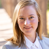 photo of Clare Barker, blond haired woman in a suit